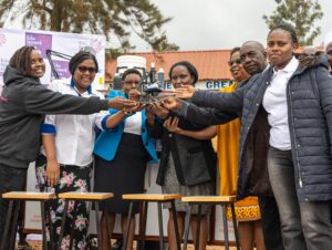 ENAF and SEPU staff hand over the mobile laboratory at Saba Saba Primary School