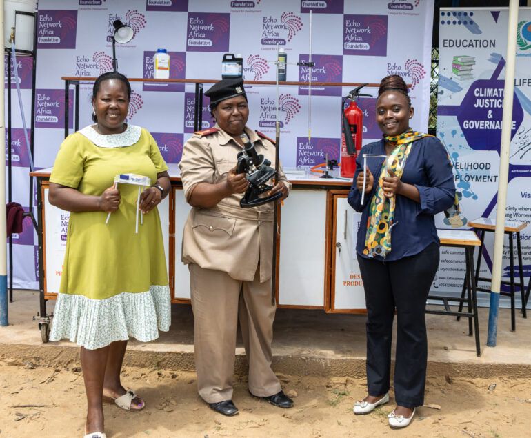 Headteacher, Doris Jeza, Senior Assistant Chief, Halima Hammad, and Science Teacher, Caroline Kache pose for a photo after the handover